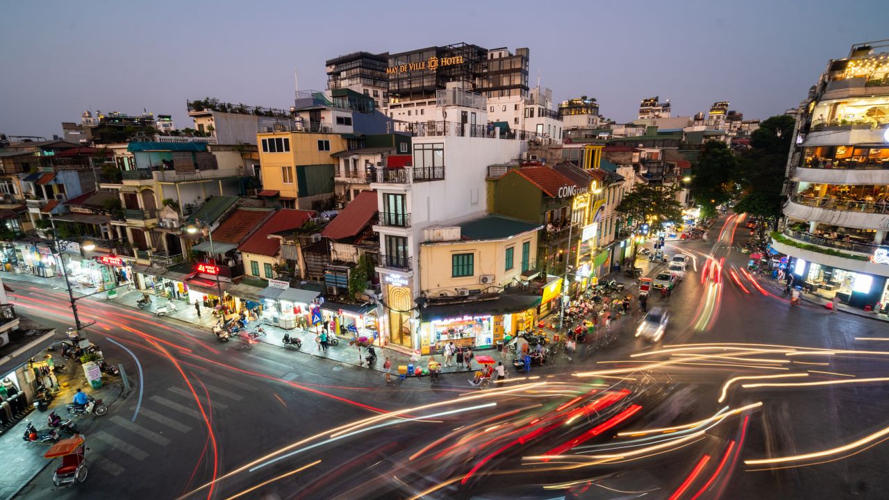 Traffic whizzes through Hanoi's old quarter